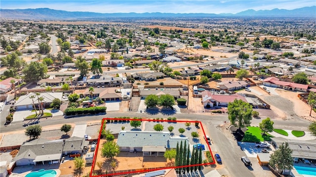 drone / aerial view featuring a mountain view