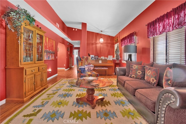 living room with lofted ceiling and hardwood / wood-style flooring