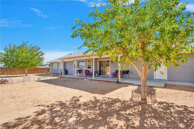 19848 Haida Rd, Apple Valley, CA 92307 - back of house with fence, a patio area, and stucco siding