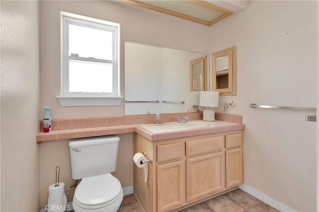 19848 Haida Rd, Apple Valley, CA 92307 - bathroom with baseboards, toilet, and vanity