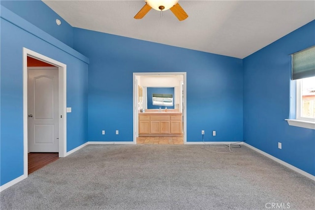 19848 Haida Rd, Apple Valley, CA 92307 - unfurnished bedroom with baseboards, lofted ceiling, a ceiling fan, ensuite bath, and carpet floors