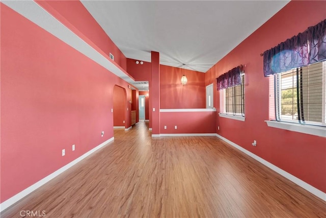 19848 Haida Rd, Apple Valley, CA 92307 - spare room with baseboards, wood finished floors, and arched walkways