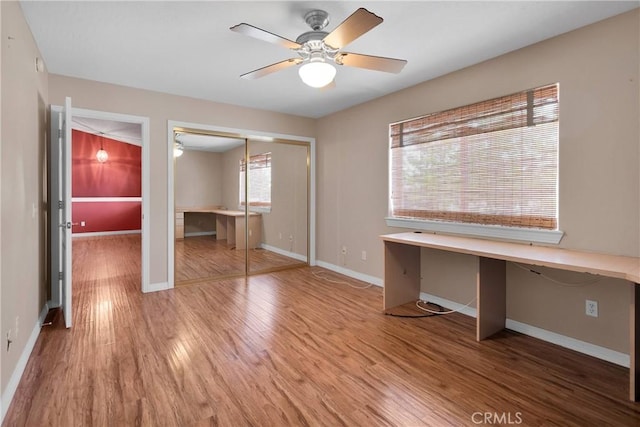 19848 Haida Rd, Apple Valley, CA 92307 - unfurnished office with built in study area, ceiling fan, and wood finished floors