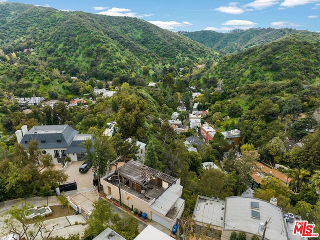 birds eye view of property featuring a mountain view