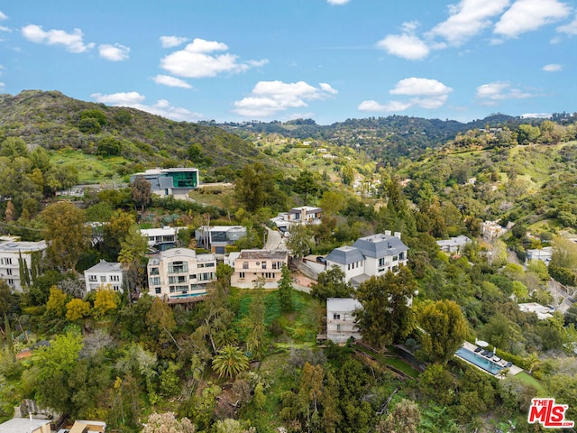 birds eye view of property with a mountain view