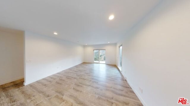 empty room with light hardwood / wood-style floors