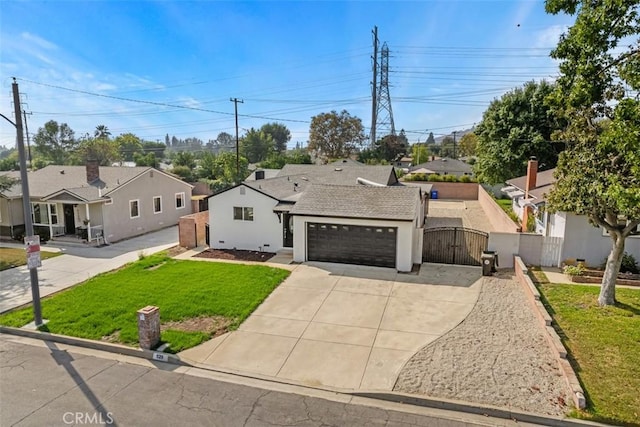 view of front of home with a front yard and a garage