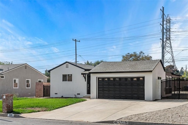 view of front of house featuring a front yard and a garage