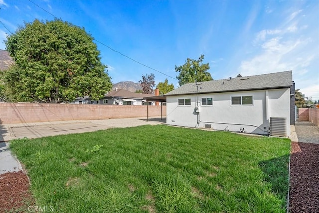 rear view of property with a lawn