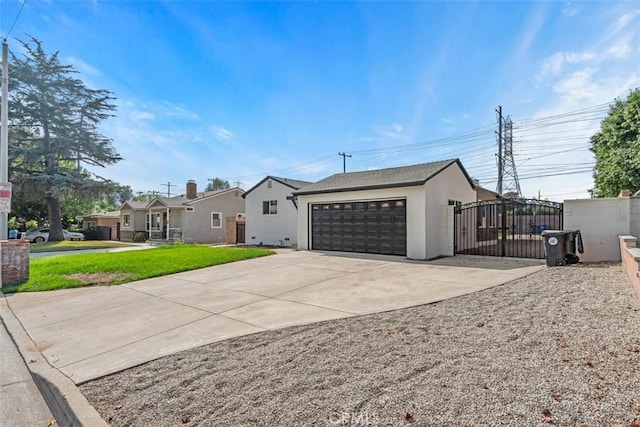 view of front facade with a front lawn and a garage