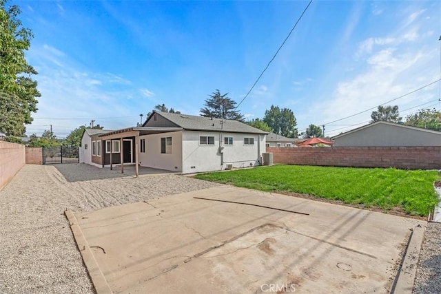 back of house with a patio area, central AC unit, and a lawn