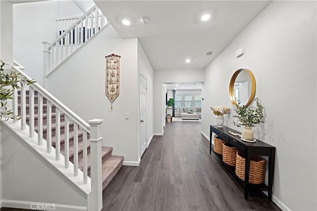 hall with dark hardwood / wood-style flooring