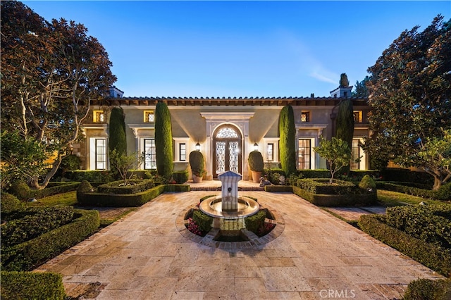 mediterranean / spanish-style house with french doors