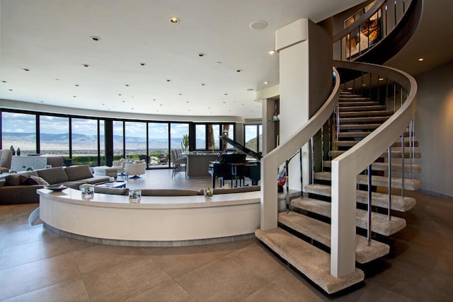 tiled living room with a mountain view