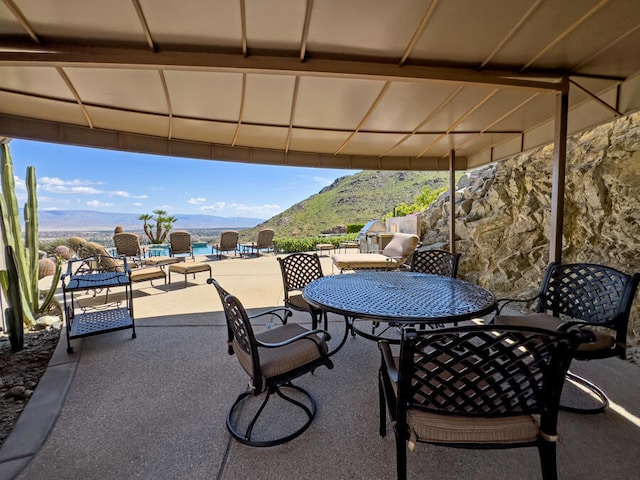 view of patio / terrace with a mountain view