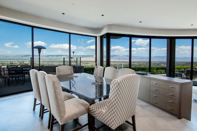 tiled dining room with a mountain view