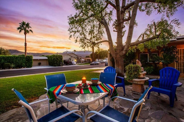 patio terrace at dusk with a yard