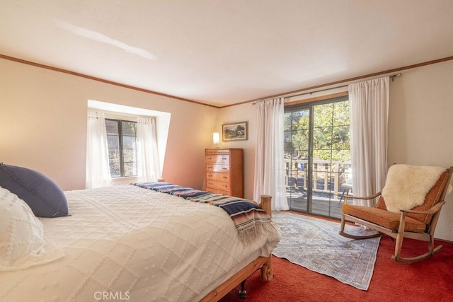 carpeted bedroom with access to exterior, ornamental molding, and multiple windows