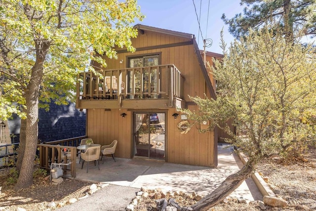 back of house with a patio area