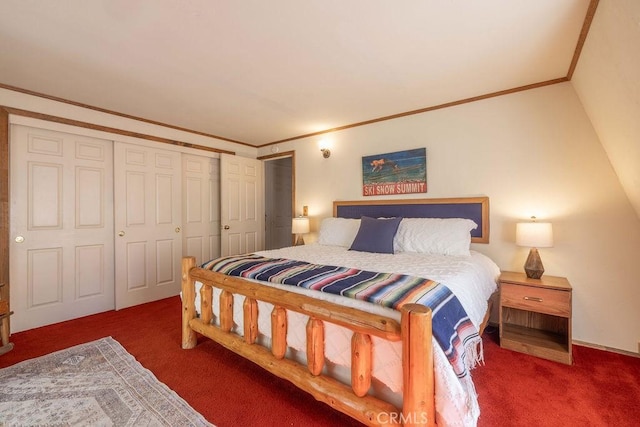 bedroom featuring vaulted ceiling, dark carpet, a closet, and crown molding