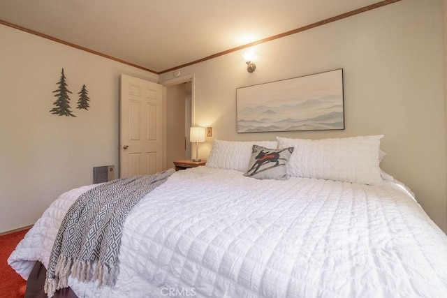 bedroom featuring carpet floors and crown molding