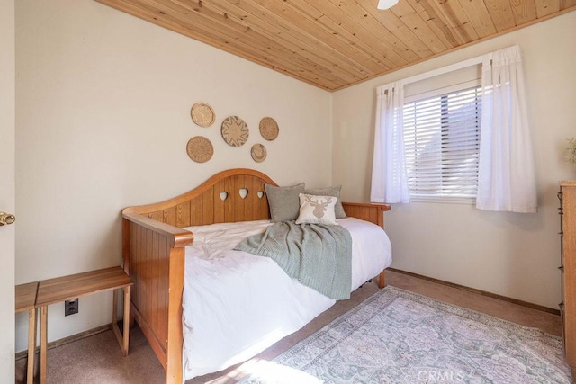 bedroom featuring light carpet and wood ceiling