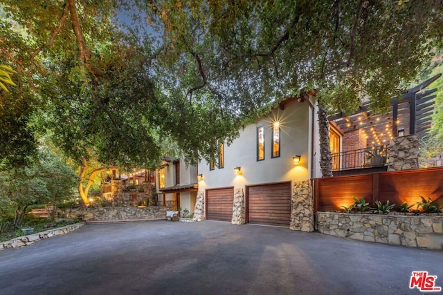 view of side of home with a garage