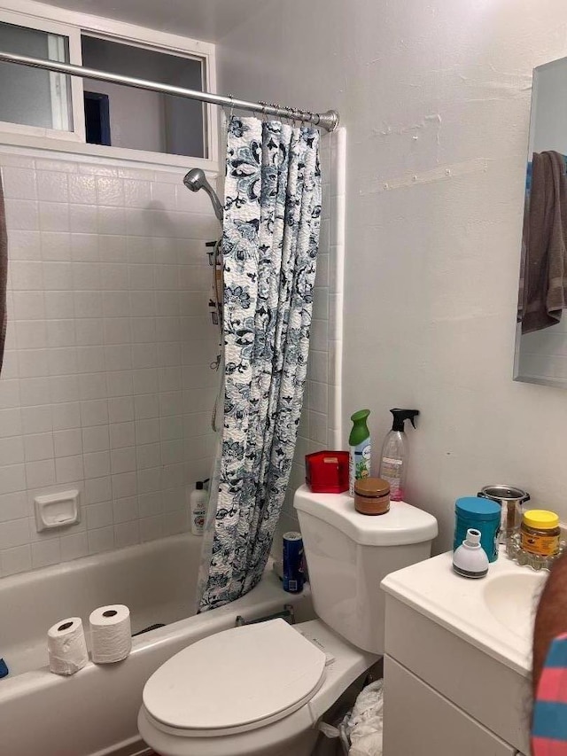 full bathroom with vanity, toilet, and shower / bath combination with curtain