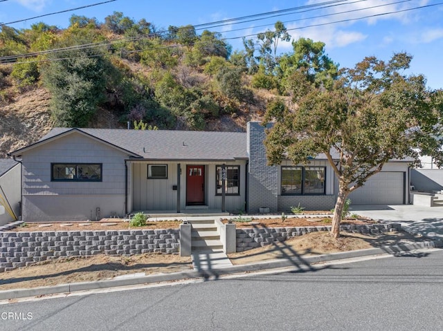 view of front facade featuring a porch and a garage