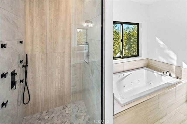 bathroom with shower with separate bathtub