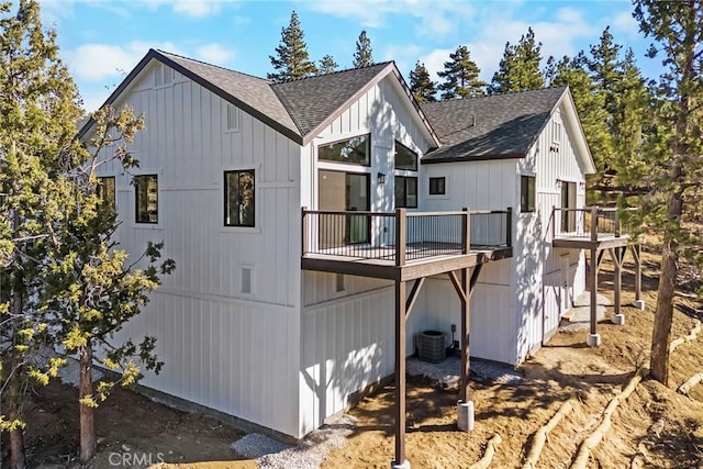 view of side of property featuring a deck and central air condition unit