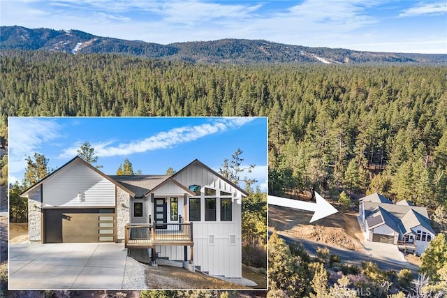 view of front of home with a mountain view and a garage