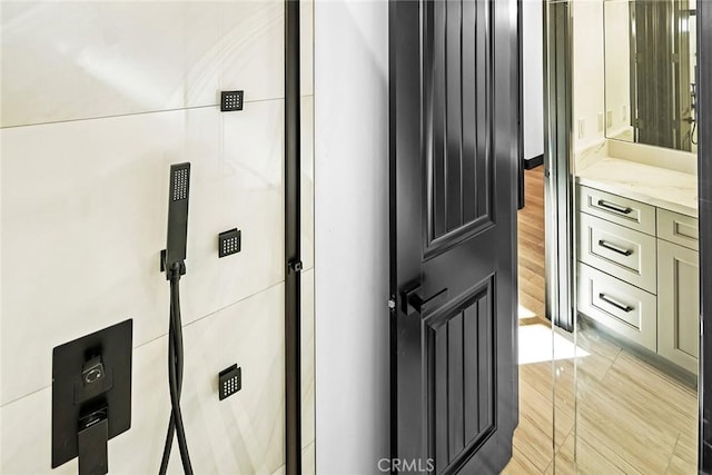 bathroom featuring hardwood / wood-style floors and vanity