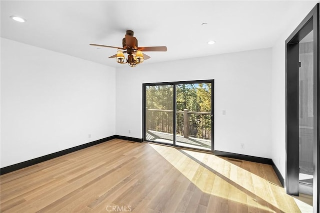 spare room with ceiling fan and light hardwood / wood-style flooring