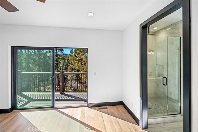 entryway with hardwood / wood-style flooring and ceiling fan