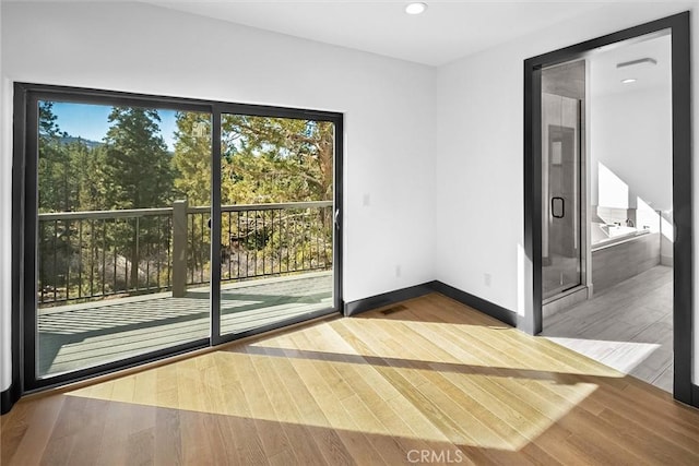 spare room with hardwood / wood-style floors