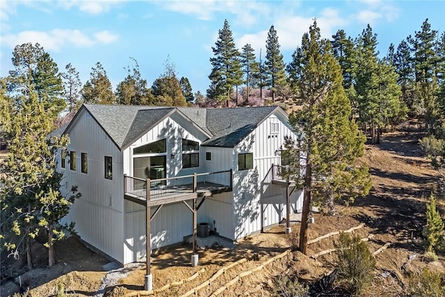 back of property featuring a balcony