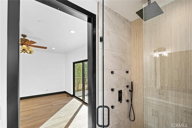 interior space with hardwood / wood-style floors and ceiling fan