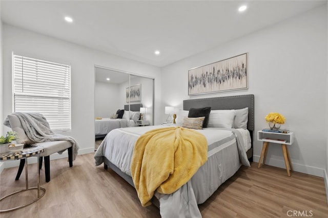 bedroom featuring a closet and light hardwood / wood-style floors