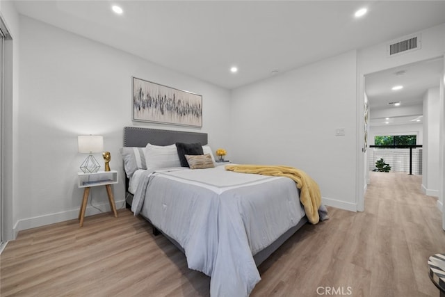 bedroom with light wood-type flooring