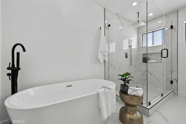 bathroom with shower with separate bathtub