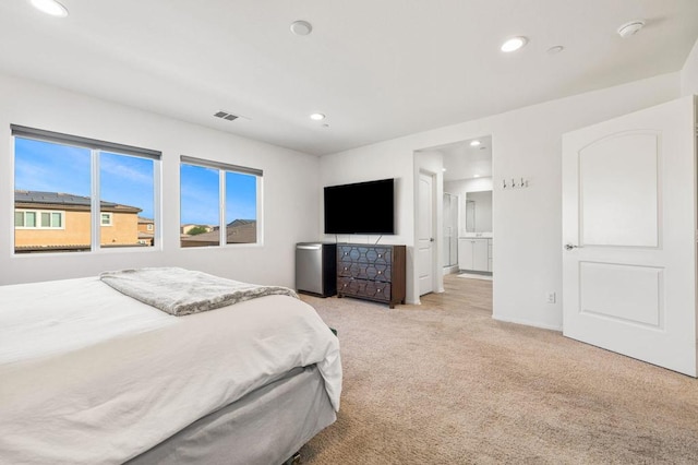 carpeted bedroom featuring stainless steel refrigerator