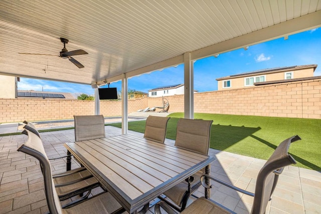 view of patio featuring ceiling fan