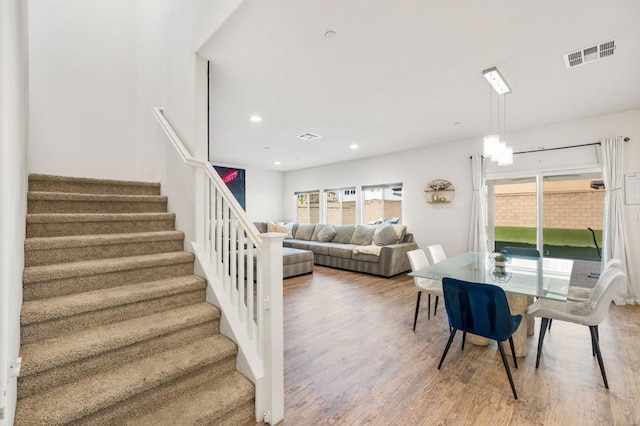 dining space featuring wood-type flooring