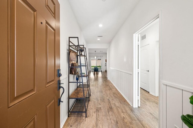 corridor featuring light hardwood / wood-style floors