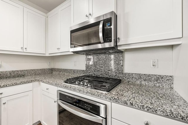 kitchen with white cabinetry and appliances with stainless steel finishes