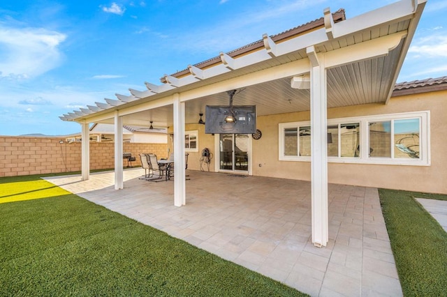 view of patio / terrace featuring ceiling fan