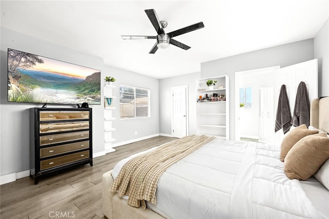 bedroom with wood-type flooring and ceiling fan