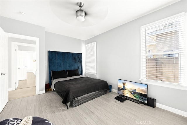 bedroom featuring ceiling fan and light hardwood / wood-style floors