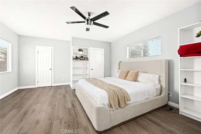 bedroom featuring ceiling fan and hardwood / wood-style flooring